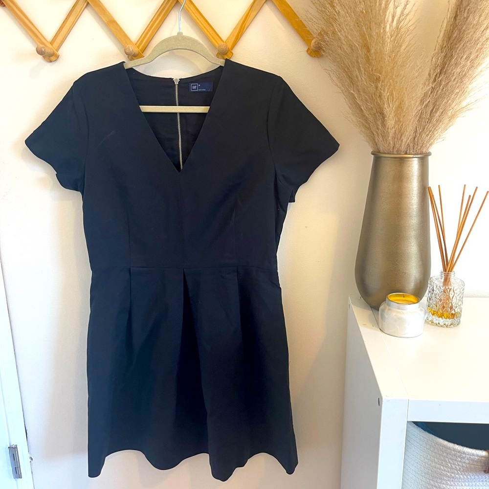 Chic short sleeve black dress. V-neck with back zipper. Size 12 from the Gap.